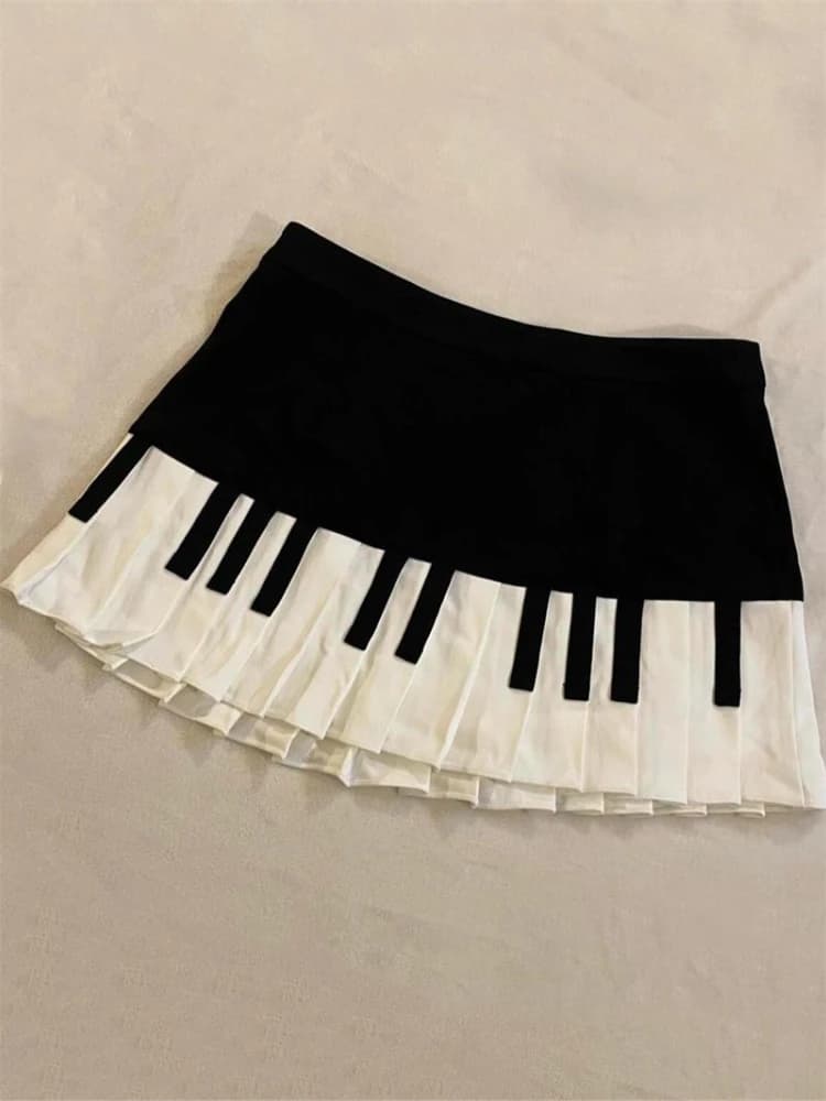 Falda corta empalmada en blanco y negro para mujer, minifalda Harajuku de diseño delgado 2025, Y2k, estilo imperio coreano, falda de Piano elegante, primavera